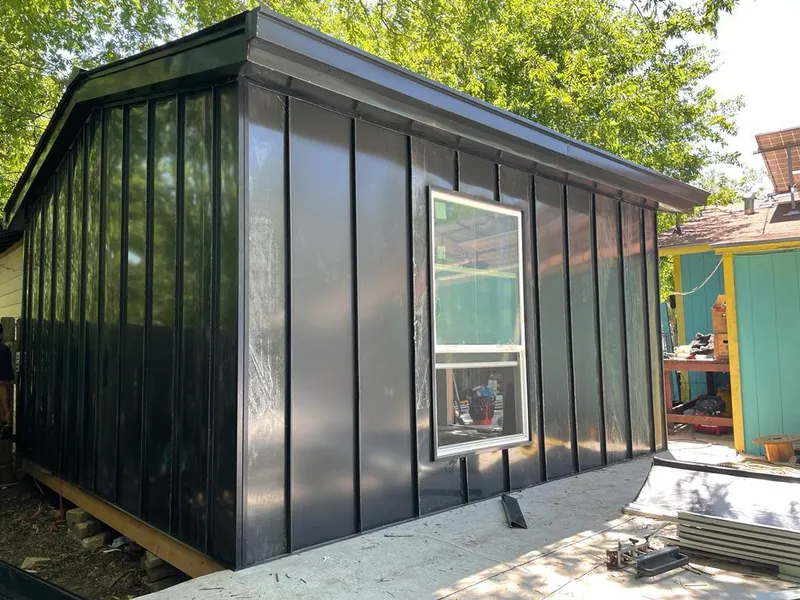 Black standing seam metal wall panels for Roof Inspection in Marengo