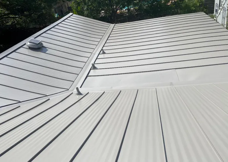 Solar attic fan installed on a metal roof for Roof Ventilation in Marengo